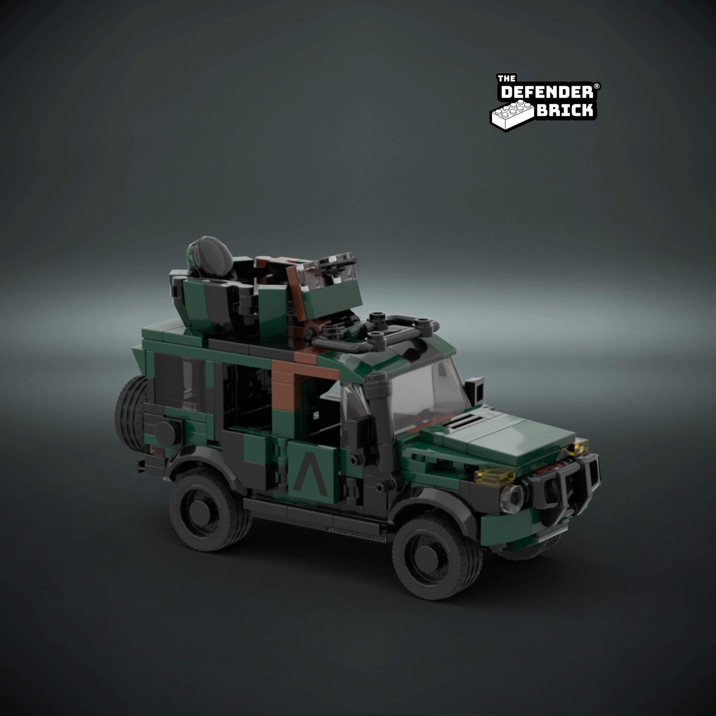 Lego scale model custom military vehicle model in army camouflage color with custom UV printed parts on a dark background with 'The Defender Brick' logo.