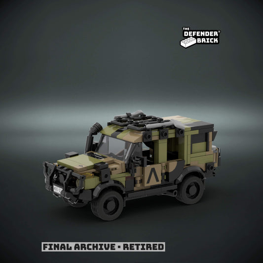 Scale model - toy vehicle made of interlocking bricks with Australian Army camouflage and custom UV printed parts on a dark background with 'The Defender Brick' branding.