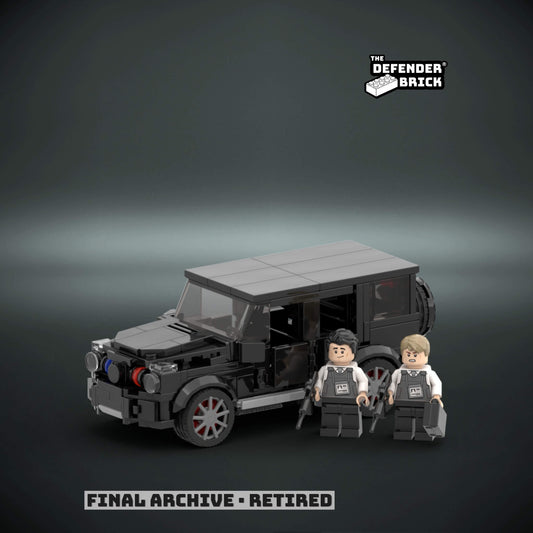 brick built police MB Wagon armored vehicle with two figures on a dark background, featuring 'The Defender Brick' branding.