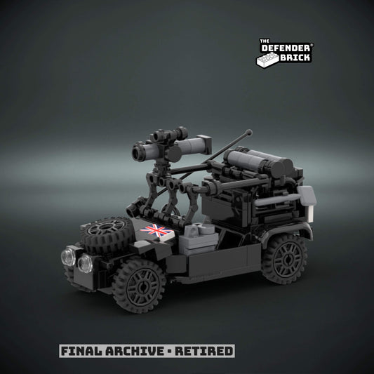 Custom Lego tactical vehicle black 'night ops' color made of interlocking bricks with a custom UV printed British flag on a dark background, branded 'The Defender Brick'.